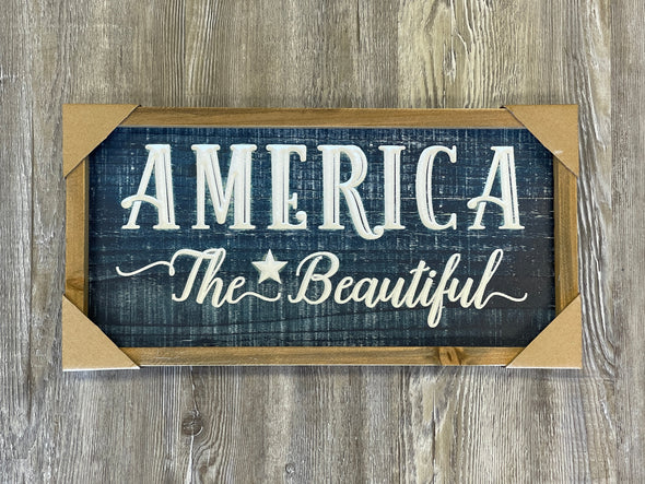 16 Inch Black Wooden Wall Sign with Brown Frame Featuring White Text "America The Beautiful" Sentiment