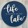 16 Inch Diameter Blue Round Sign Decor Featuring "Life is Better at the Lake" Phrase