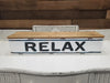 31 Inch White Metal Wall Shelf with Wooden Cover Featuring "Relax" Sentiment