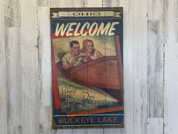 30 Inch Wooden Wall Art Sign Featuring "Welcome To The Lake, Where Everyday Is An Adventure" Sentiment with Couple Boating Design