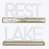 White Wooden Tabletop Signs Featuring "Rest" and "Lake" Sentiment with Paddle Design